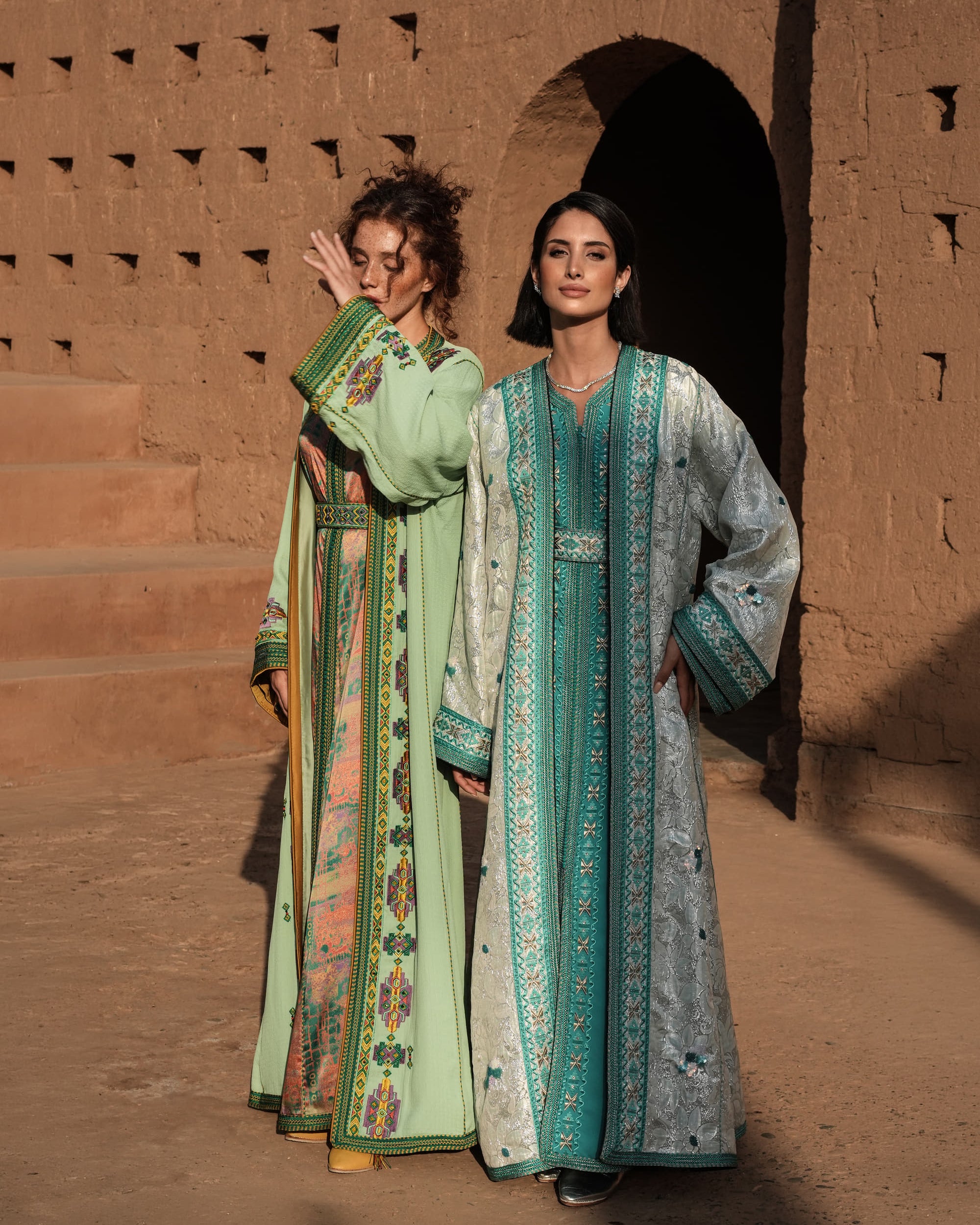 Azure Constellation turquoise Moroccan kaftan with star embroidery under an ivory brocade mansouria, shown alongside a second look