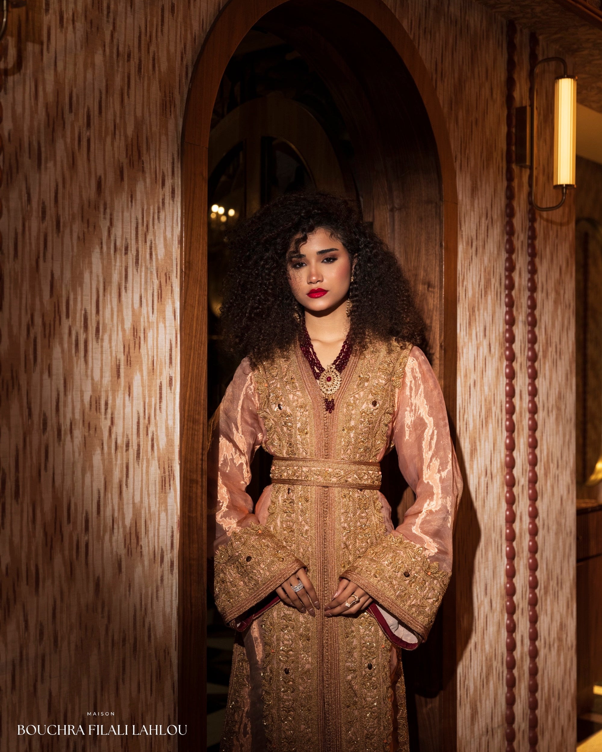 Rose and gold Moroccan caftan detail with ornate embroidery and refined bridal silhouette