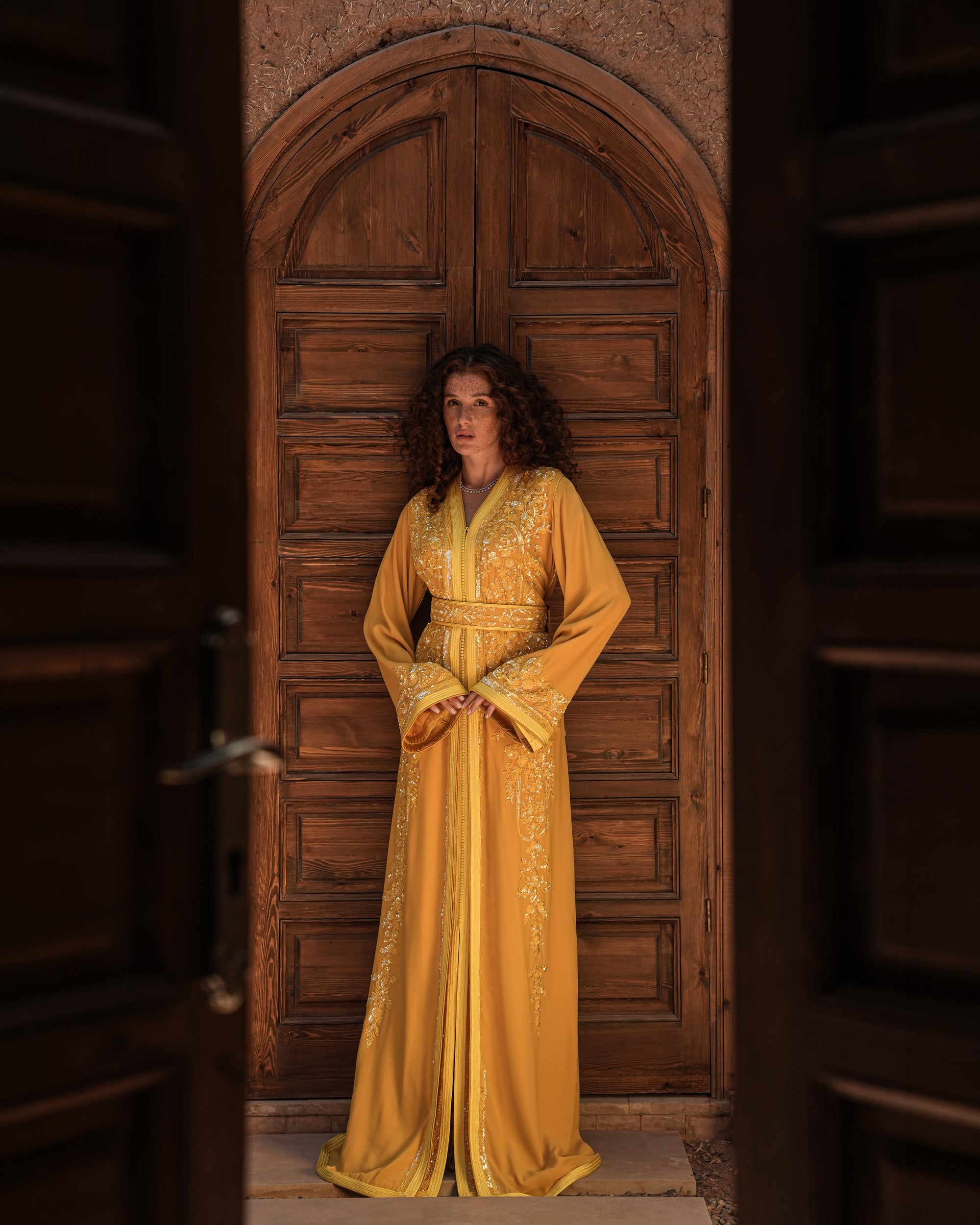 Saffron Vespers saffron crepe Moroccan kaftan with gold and silver embroidery, full-length view
