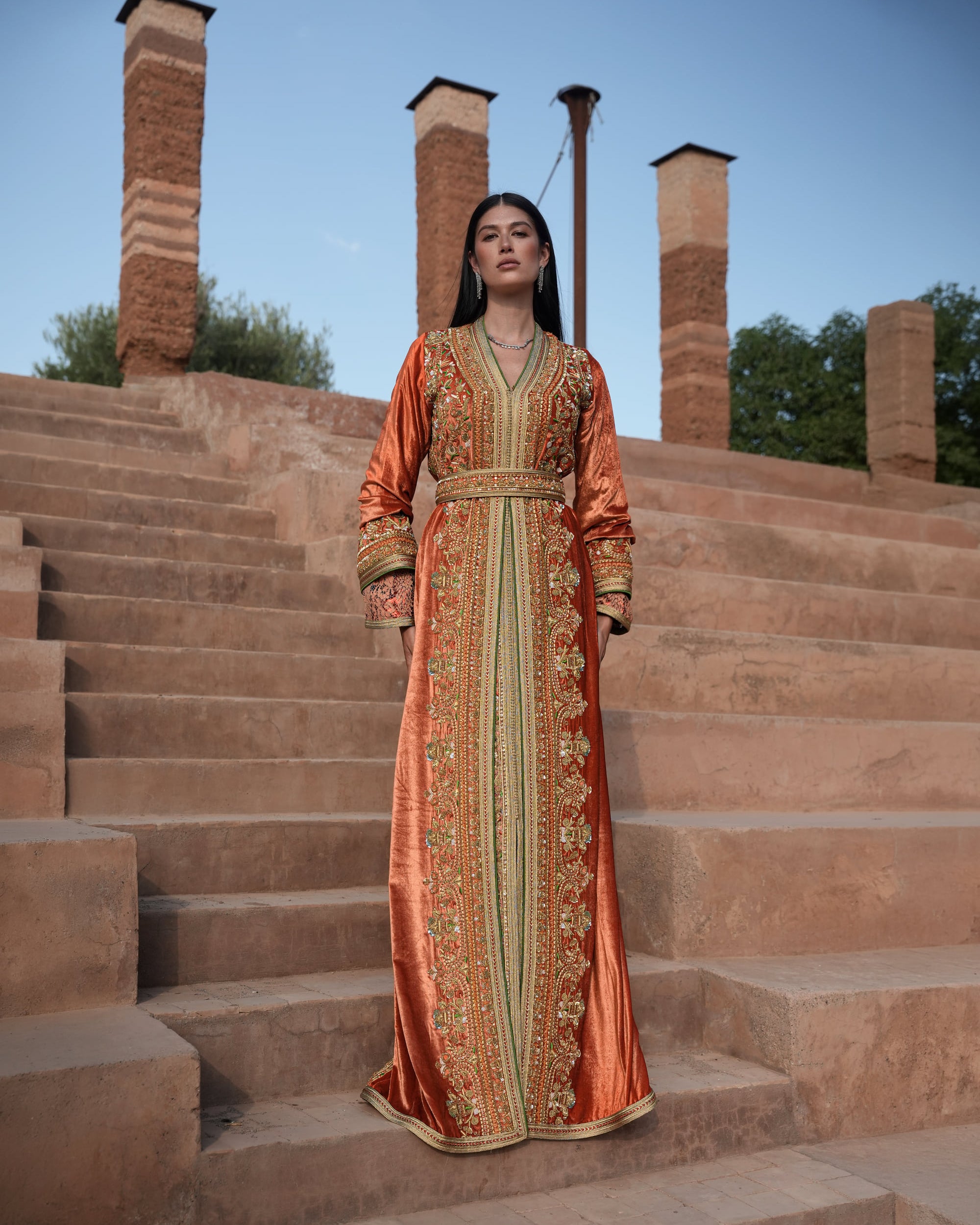 Terracotta Zenith rust velvet Moroccan kaftan with gold and green embroidery, full-length view