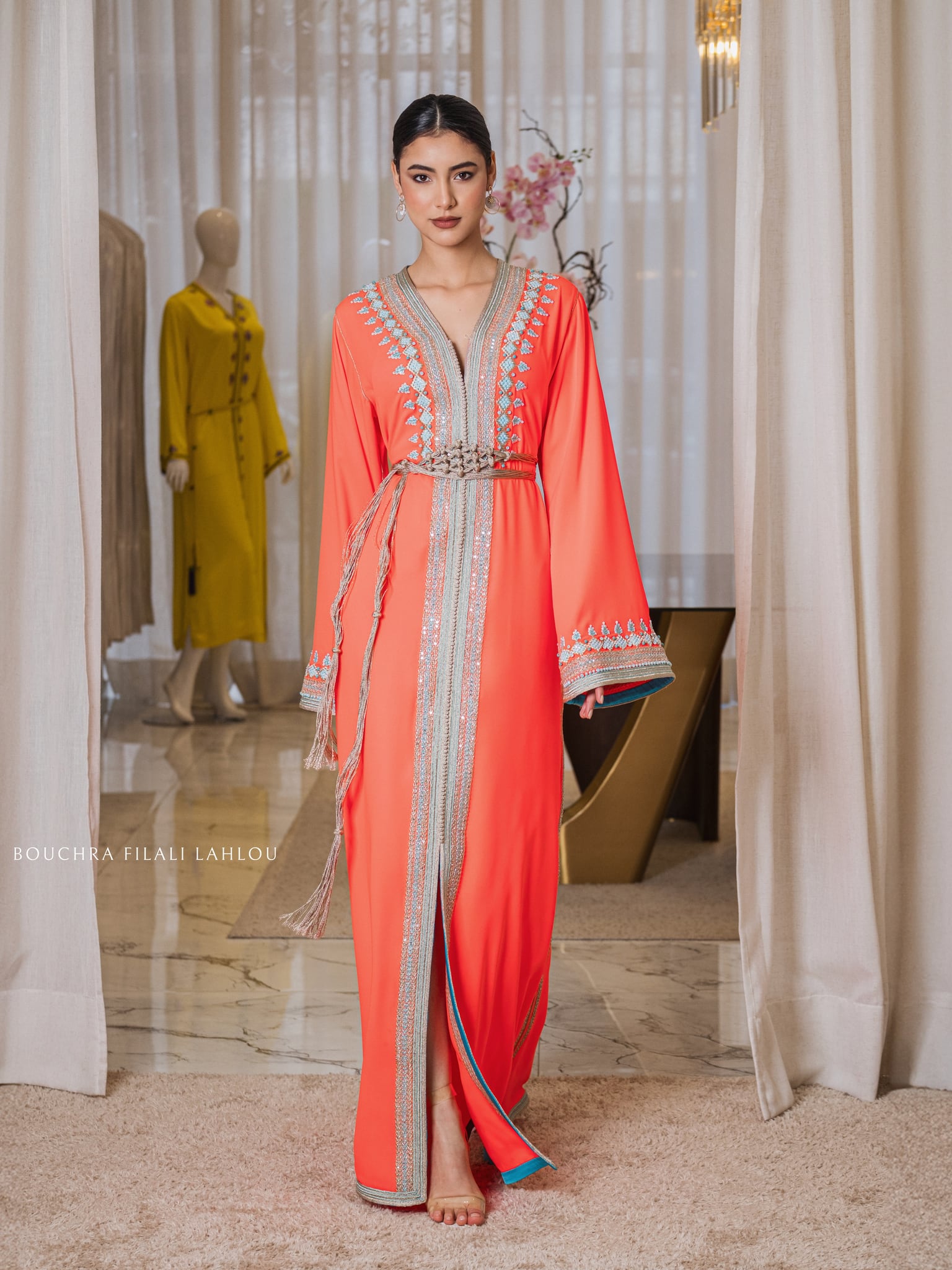 Persimmon dress with a silver braid from collar to hem and a matching woven belt